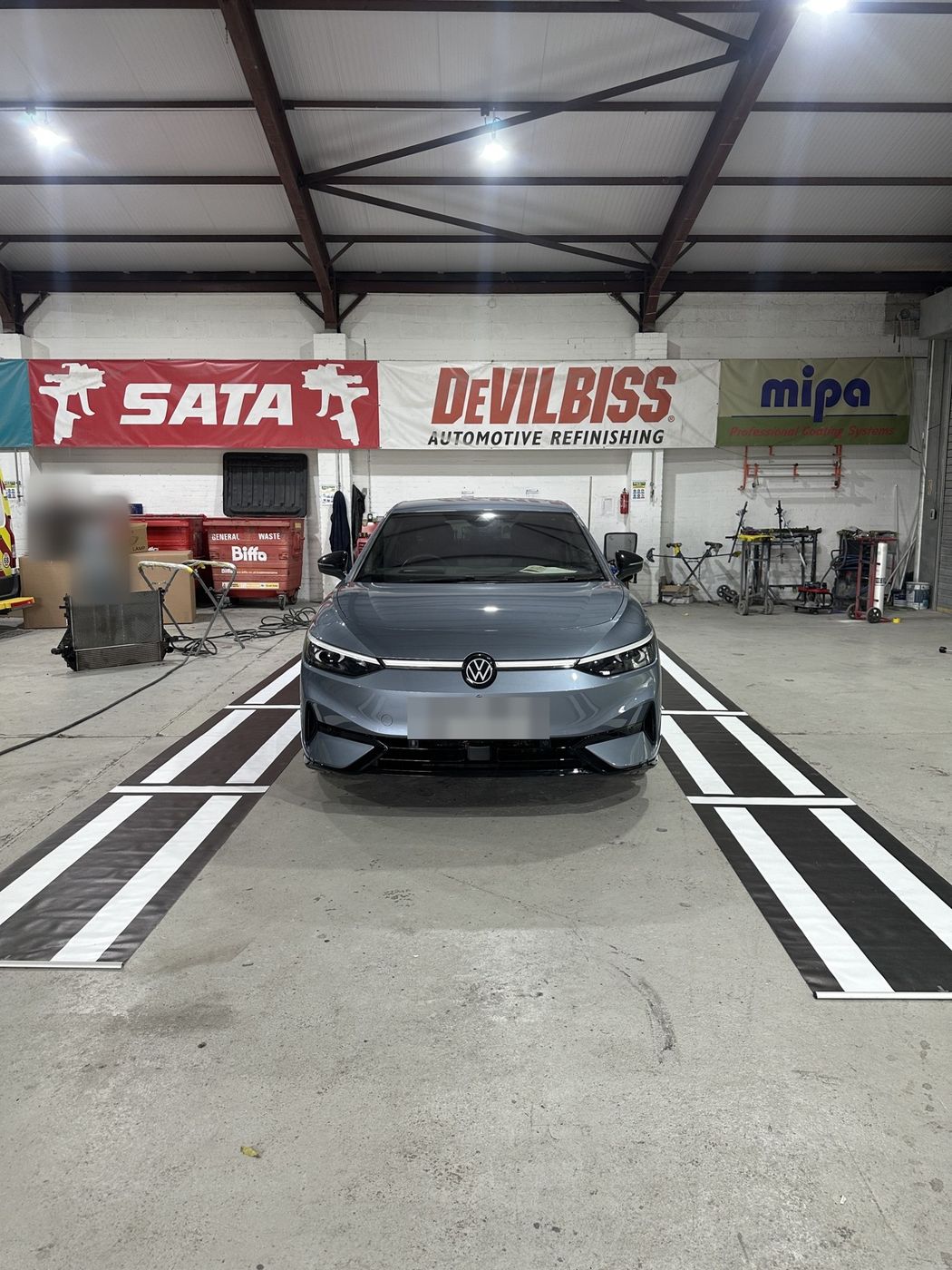 360° camera calibration lines set up around a VW ID.7 in Sheffield